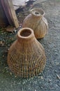 Bamboo fish trap and creel for fresh water fish in the river in Thailand