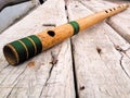 Bamboo flute on a wooden surface