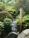 Bamboo fountain by the stream in Japanese Garden in Wroclaw, Poland