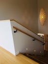 Bamboo hanging pendant lamps with high ceiling background next to the stair.