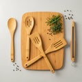 Bamboo kitchen utensils, including two slotted spatulas, a solid spoon, and tongs, Royalty Free Stock Photo