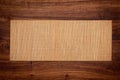 Bamboo mat on teak table top. tea table. Wooden frame on wood background. Royalty Free Stock Photo