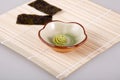 A bamboo mat and two laver and wasabi Royalty Free Stock Photo