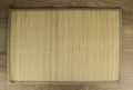 Bamboo napkin on a dark wooden table, top view Royalty Free Stock Photo