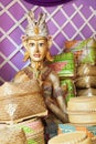Bamboo offering boxes and traditional ceremonial balinese man figure