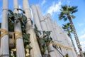 bamboo and palm tree under blue cloudy sky Royalty Free Stock Photo