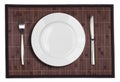 Bamboo placemat with plate fork and knife Royalty Free Stock Photo