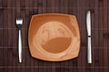 Bamboo placemat with square plate fork and knife