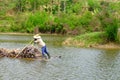 Carrying sugarcane by a bamboo raft