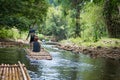 Bamboo rafting in green tropical scenery