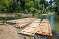 Bamboo rafts on green tropical river Royalty Free Stock Photo