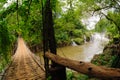 The bamboo rope bridge in Tad Pha Souam waterfall, Laos. Royalty Free Stock Photo