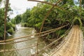 The bamboo rope bridge in Tad Pha Souam waterfall, Laos. Royalty Free Stock Photo