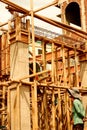 Construction site with bamboo scaffolding and. Royalty Free Stock Photo