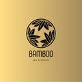 Bamboo spa salon logo. Spa emblem. Bamboo leaves in a circle with letters. Gold background.