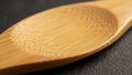 A bamboo spoon showcasing its smooth texture and natural grain Royalty Free Stock Photo