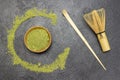 Bamboo spoon and whisk for matcha tea on the table. Green Matcha tea powder in a wooden bowl Royalty Free Stock Photo