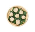 Bamboo steamer with leaves and tasty baozi dumplings Royalty Free Stock Photo