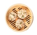 Bamboo steamer with tasty baozi dumplings on white background Royalty Free Stock Photo