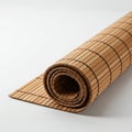 A bamboo sushi rolling mat (makisu) is neatly rolled on a white surface. Made of thin Royalty Free Stock Photo