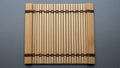 Bamboo sushi rolling mat makisu with parallel wooden slats and dark woven Royalty Free Stock Photo