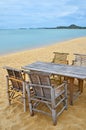 Bamboo table and chairs on sand beach