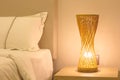 Bamboo table lamp orange near bad