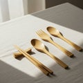 Bamboo tableware set on a beige tablecloth. Includes a pair of chopsticks resting on Royalty Free Stock Photo