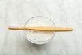 Bamboo toothbrush, dentifrice tooth powder on white marble background. Biodegradable natural bamboo toothbrush. Eco friendly, Zero