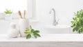 Bamboo toothbrushes in holder on table against blurred bathroom background Royalty Free Stock Photo