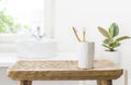 Bamboo toothbrushes in wooden table in bathroom with copy space