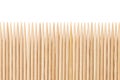 Bamboo toothpicks are placed in parallel - backgrounds, textures. Bamboo toothpicks isolated on white background Royalty Free Stock Photo