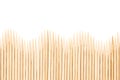 Bamboo toothpicks are placed in parallel - backgrounds, textures. Bamboo toothpicks isolated on white background Royalty Free Stock Photo