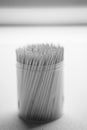 Bamboo toothpicks in a round plastic box on the table close-up Royalty Free Stock Photo