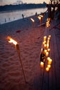 Bamboo torches. night lit torch on the beach