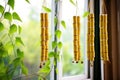 bamboo wind chimes hanging near a window