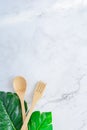 Bamboo wood toothbrush on clean white marble table top view background concept for save the earth day, world environmental, Royalty Free Stock Photo