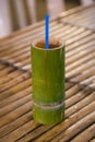 Bamboo wooden cup with traditional drink sold at night market Royalty Free Stock Photo
