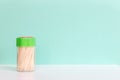 Bamboo or wooden toothpick in a plastic box on green background. Concept, Free space for text Royalty Free Stock Photo