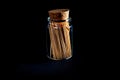 bamboo wooden toothpicks in glass jar, wine glass. in bucket. toothpicks on black background. front view toothpicks, dropped from Royalty Free Stock Photo