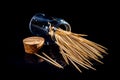 bamboo wooden toothpicks in glass jar, wine glass. in bucket. toothpicks on black background. front view toothpicks, dropped from Royalty Free Stock Photo