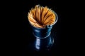 bamboo wooden toothpicks in glass jar, wine glass. in bucket. toothpicks on black background. front view toothpicks, dropped from Royalty Free Stock Photo