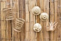 Bamboo wooden wall decoration with palm leaves hat and bamboo baskets background Royalty Free Stock Photo