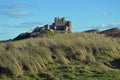 Bamburgh Castle from over the dunes, England Royalty Free Stock Photo