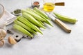 Bamya or okra on cutting board, fresh Egyptian okra ready for cooking on gray background, copy space Royalty Free Stock Photo
