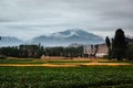 Landscape of a field surrounded by beautiful mountains under a stormy sky in Bamyan, Afghanistan Royalty Free Stock Photo