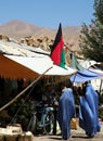 Women in blue burqas go shopping in Bamiyan, Afghanistan