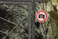 The ban on photographing the object. A sign at the entrance gate metal. The caves in the national park.