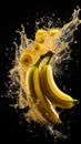banana with water drops. falling bananas. banana juice. yellow liquid splash.