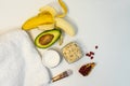 Banana and avocado for a handmade face mask and ingredients on a white table. Skin care. Homemade natural ingredients for